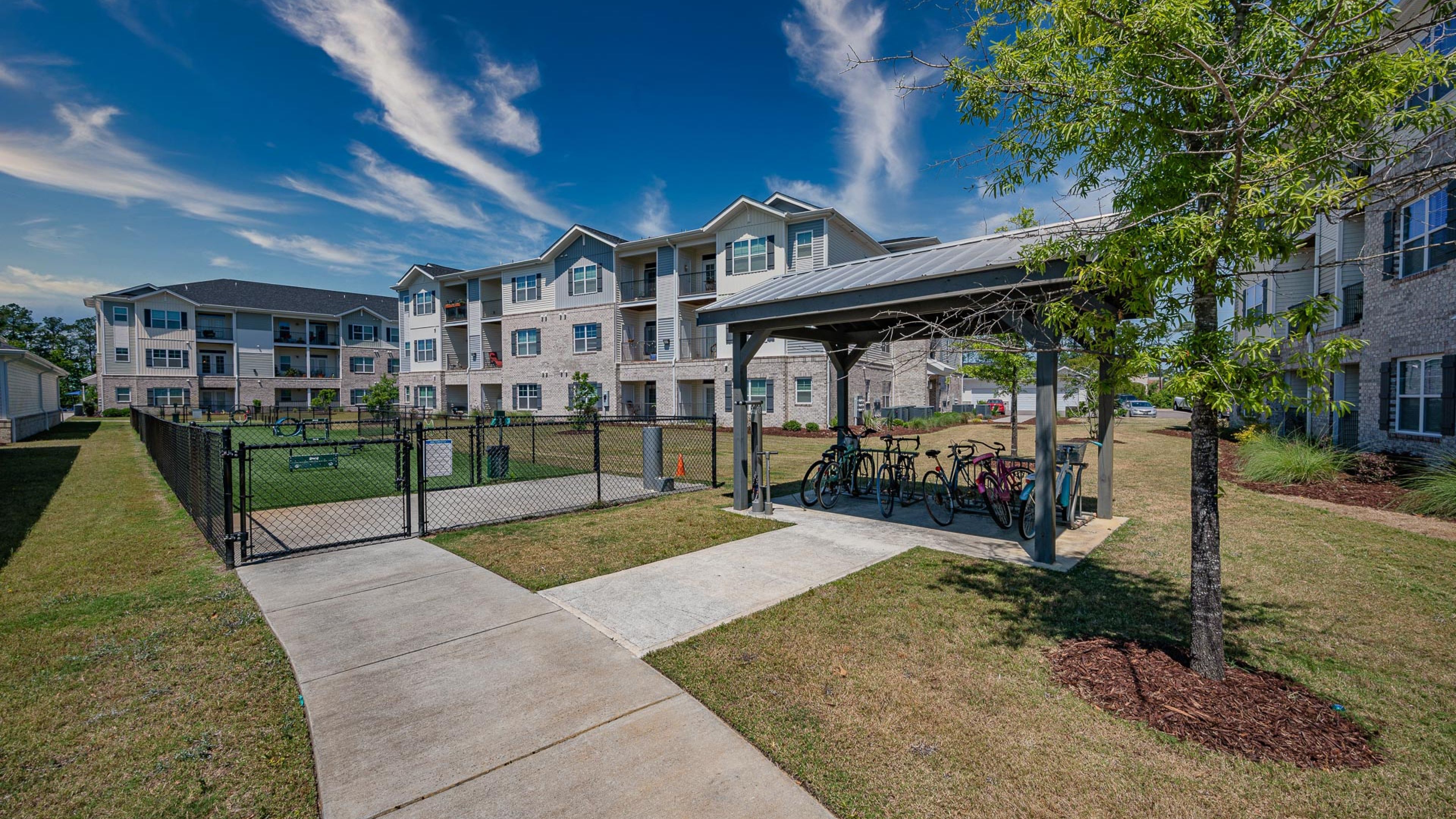 Hawthorne at Leland apartments community exterior with large green lawn